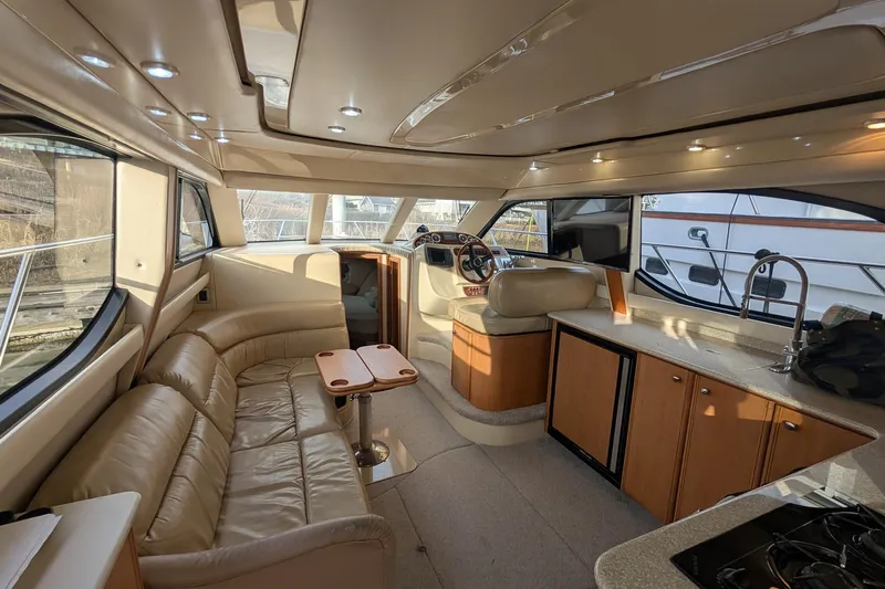 One Life Yacht Photos Pics Luxurious interior of a 2004 Meridian 341 yacht with leather seating and modern amenities.