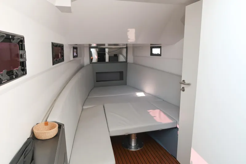  Yacht Photos Pics Interior cabin of 2023 Pirelli 42 boat with modern seating and windows.