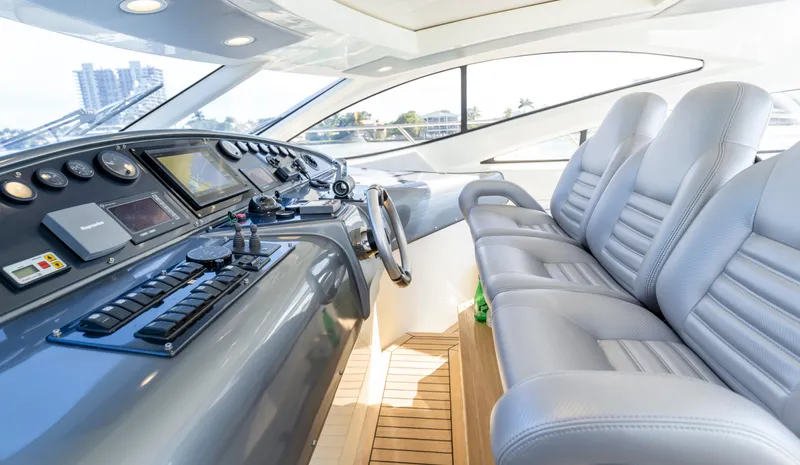 Astondoa 53 Open Yacht Photos Pics Luxurious 2005 Astondoa 53 Open yacht cockpit with modern controls and plush seating.