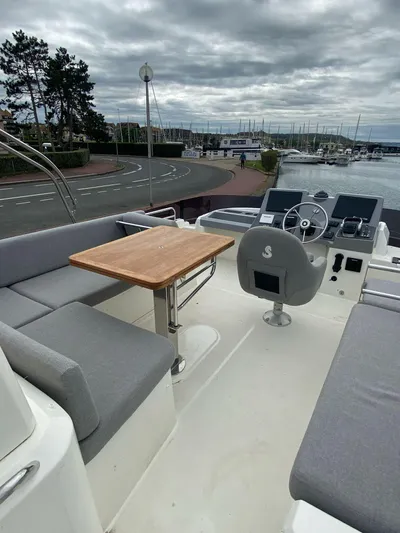  Yacht Photos Pics 2023 Beneteau Swift Trawler 41 Fly, featuring a spacious flybridge with seating and helm.