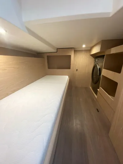  Yacht Photos Pics 2023 Beneteau Swift Trawler 41 Fly cabin with bed and storage.