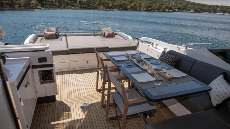  Yacht Photos Pics Luxury Azimut S7 yacht deck with dining area, overlooking serene waters, 2018 model.