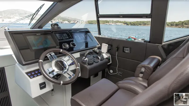  Yacht Photos Pics Helm of 2018 Azimut S7 yacht with modern controls and leather seating.