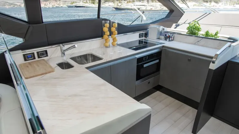  Yacht Photos Pics Luxurious kitchen interior of 2018 Azimut S7 yacht with modern appliances and sleek design.