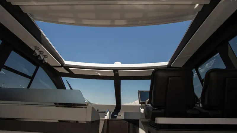  Yacht Photos Pics Interior view of 2018 Azimut S7 yacht with panoramic sunroof and modern seating.