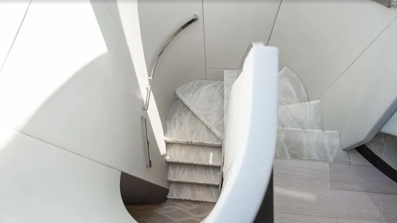  Yacht Photos Pics Staircase inside 2018 Azimut S7 yacht, featuring sleek modern design and elegant curves.