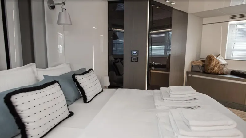  Yacht Photos Pics Luxurious bedroom interior of 2018 Azimut S7 yacht with modern decor and plush bedding.
