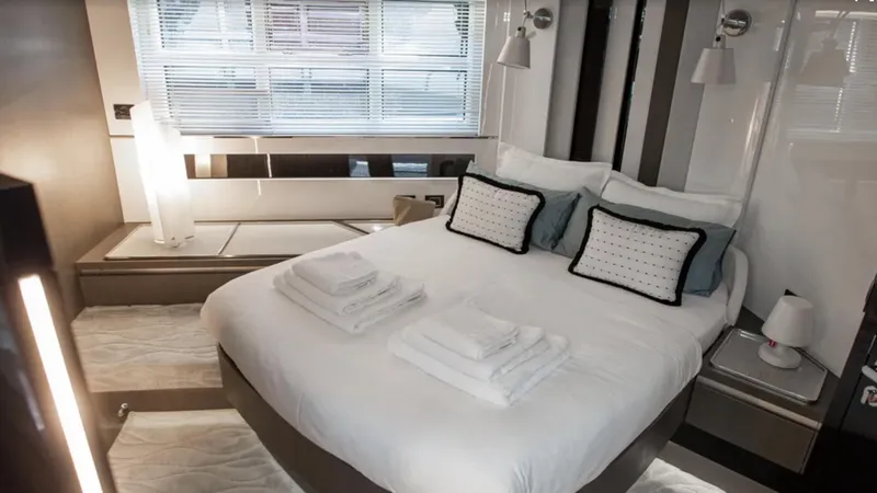  Yacht Photos Pics Luxurious bedroom interior of 2018 Azimut S7 yacht with modern decor and elegant bedding.