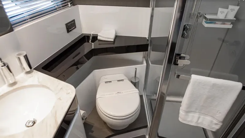  Yacht Photos Pics Luxurious bathroom in 2018 Azimut S7 yacht with modern fixtures and elegant design.