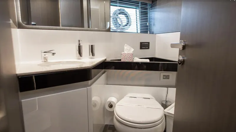  Yacht Photos Pics Luxurious bathroom in 2018 Azimut S7 yacht with modern fixtures and sleek design.