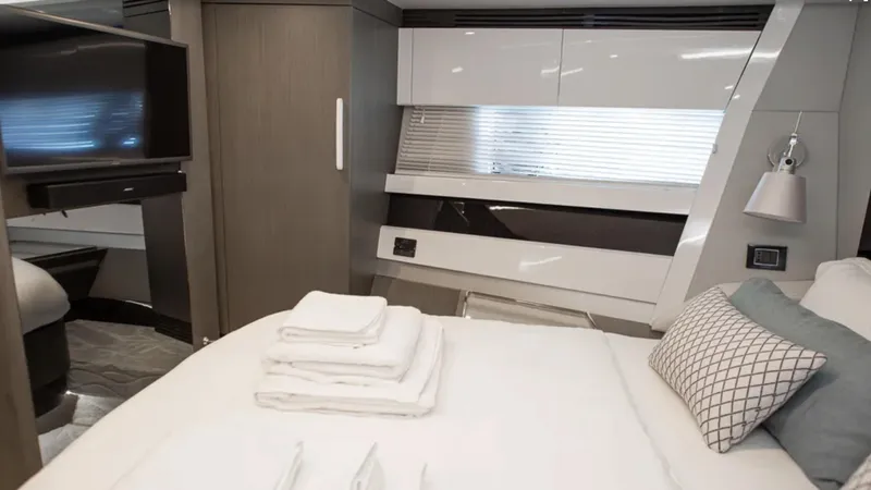  Yacht Photos Pics Luxurious bedroom interior of 2018 Azimut S7 yacht with modern design and elegant furnishings.