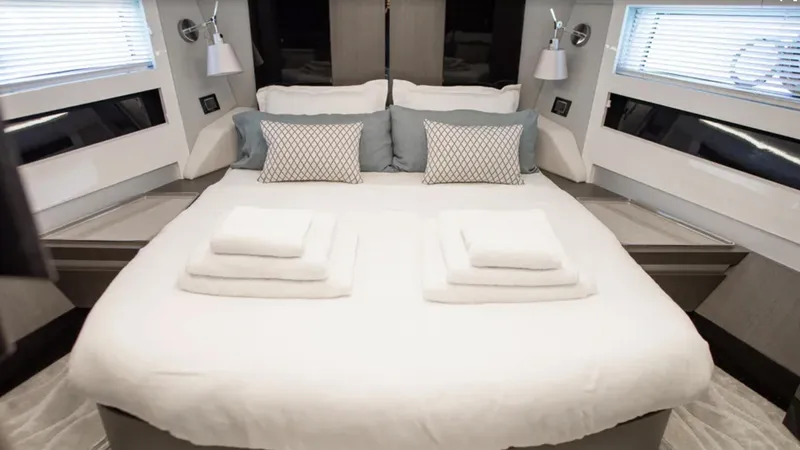  Yacht Photos Pics Luxurious bedroom interior of 2018 Azimut S7 yacht with elegant bedding and modern design.