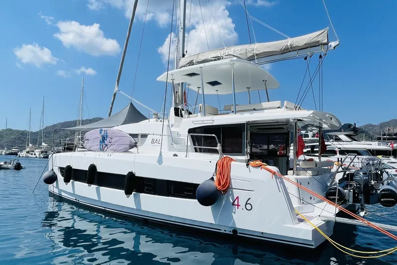  Yacht Photos Pics Modern Bali 4.6 catamaran yacht docked in marina, 2025 model, under clear blue sky.