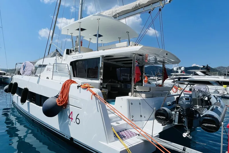  Yacht Photos Pics 2025 Bali 4.6 catamaran docked at marina, featuring modern design and spacious deck.