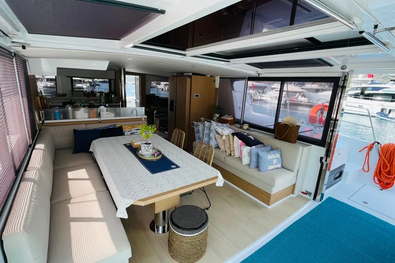  Yacht Photos Pics Luxurious interior of 2025 Bali 4.6 yacht with elegant dining area and marina view.