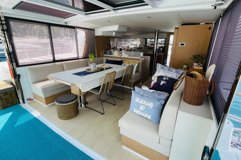  Yacht Photos Pics Luxurious interior of 2025 Bali 4.6 yacht with modern dining and seating area.