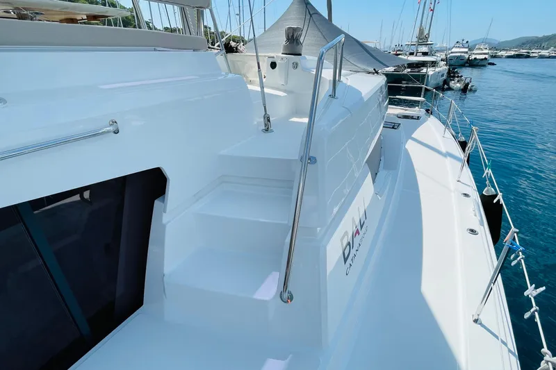  Yacht Photos Pics Modern Bali 4.6 catamaran yacht docked at marina, showcasing sleek design and spacious deck.