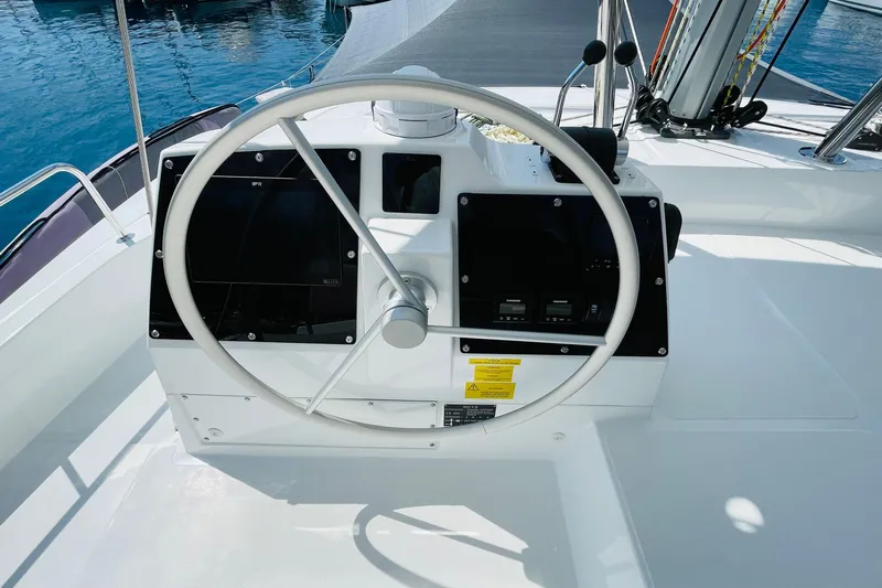  Yacht Photos Pics Steering wheel of 2025 Bali 4.6 yacht, featuring modern navigation controls and sleek design.