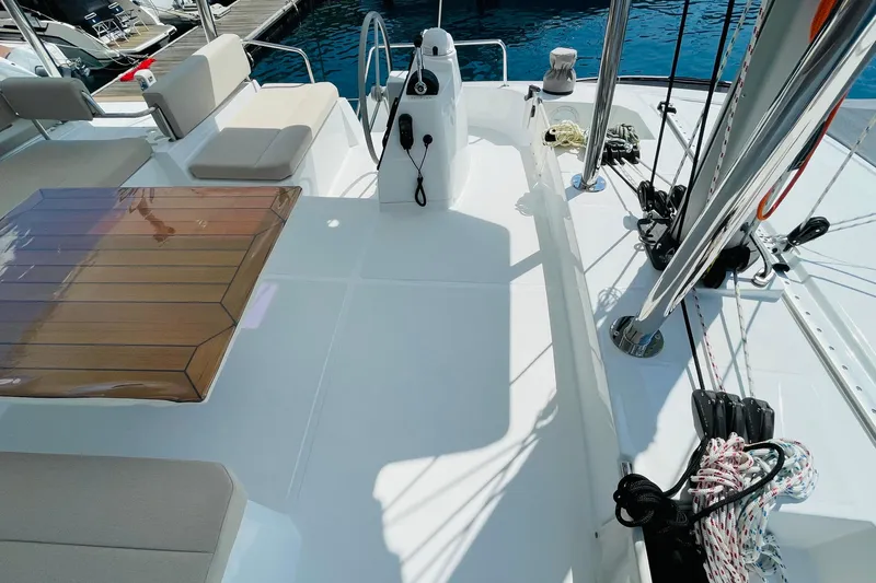  Yacht Photos Pics Spacious deck of 2025 Bali 4.6 yacht with seating and steering wheel.