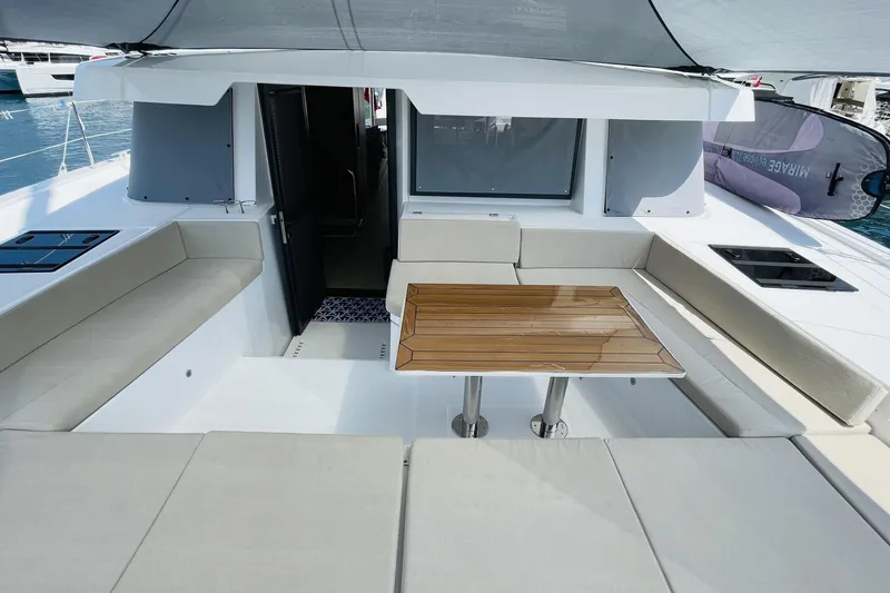  Yacht Photos Pics Modern Bali 4.6 yacht interior with sleek seating and wooden table, 2025 model.