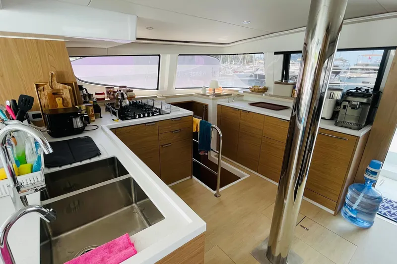  Yacht Photos Pics Modern kitchen interior on 2025 Bali 4.6 yacht with sleek design and appliances.