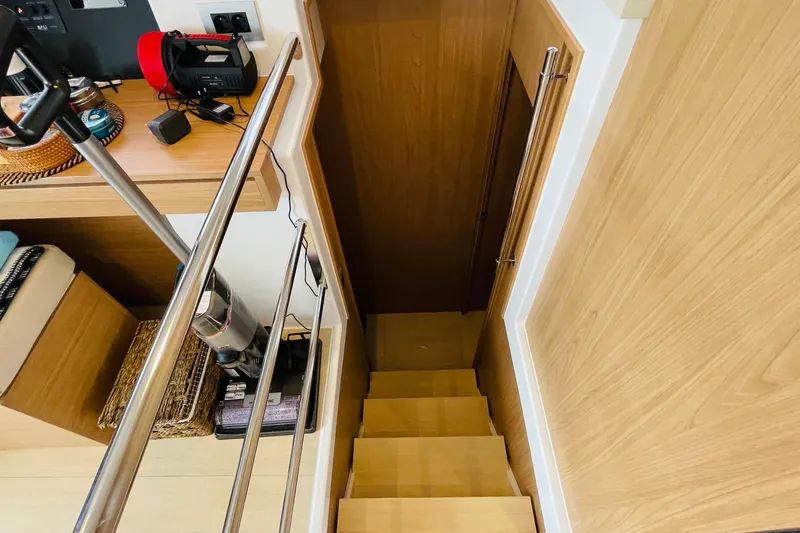  Yacht Photos Pics Staircase on Bali 4.6 yacht, featuring wooden steps and modern railing, 2025 model.