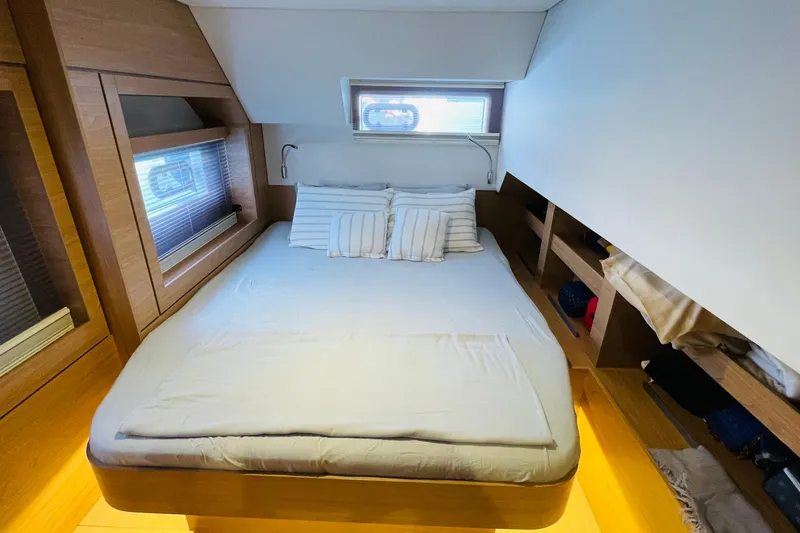  Yacht Photos Pics Luxurious cabin interior of 2025 Bali 4.6 yacht with cozy bed and modern design.