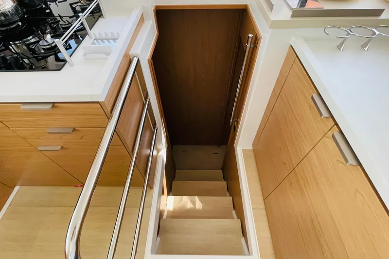  Yacht Photos Pics Modern yacht interior with wooden cabinetry and stairs, Bali 4.6 model, 2025.