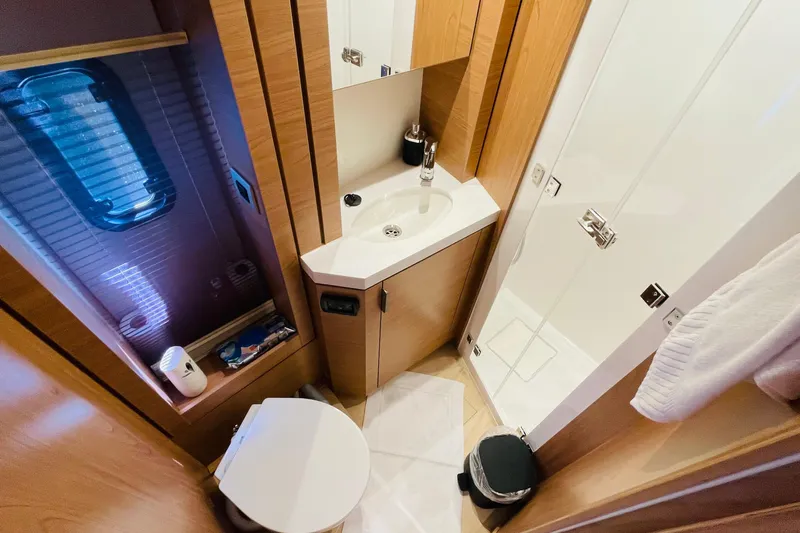  Yacht Photos Pics Modern bathroom in 2025 Bali 4.6 yacht with shower, sink, and toilet.