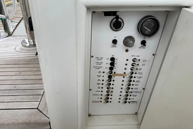 High Tide Yacht Photos Pics Control panel on a 1988 Buddy Davis 47 Convertible yacht, featuring switches and gauges.