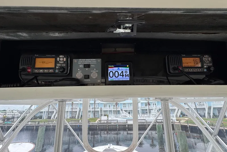 High Tide Yacht Photos Pics 1988 Buddy Davis 47 Convertible cockpit with navigation and communication equipment.