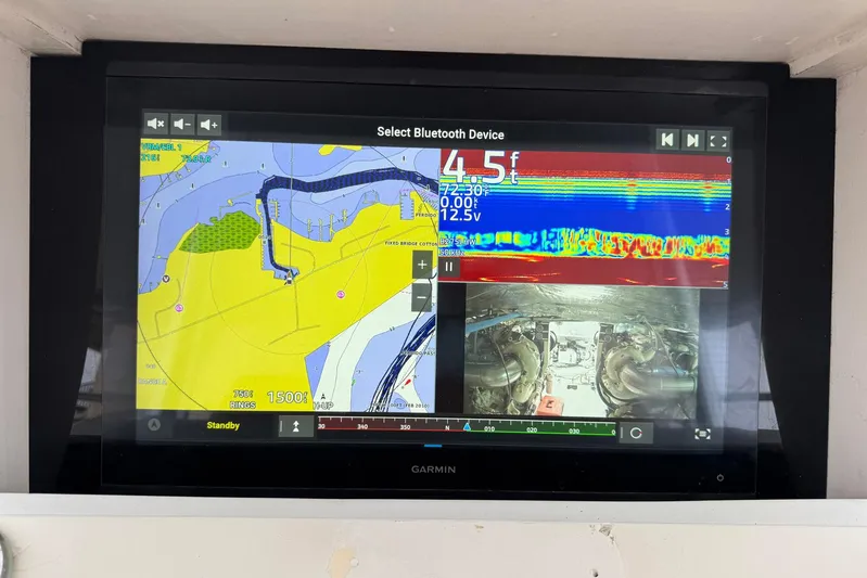 High Tide Yacht Photos Pics Garmin marine display on 1988 Buddy Davis 47 Convertible, showing navigation and sonar data.