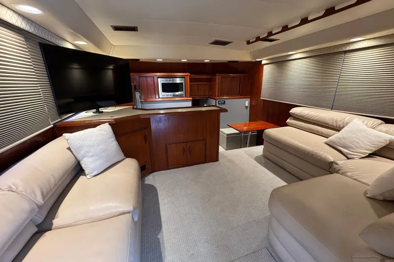 High Tide Yacht Photos Pics Luxurious interior of a 1988 Buddy Davis 47 Convertible yacht with plush seating and modern amenities.