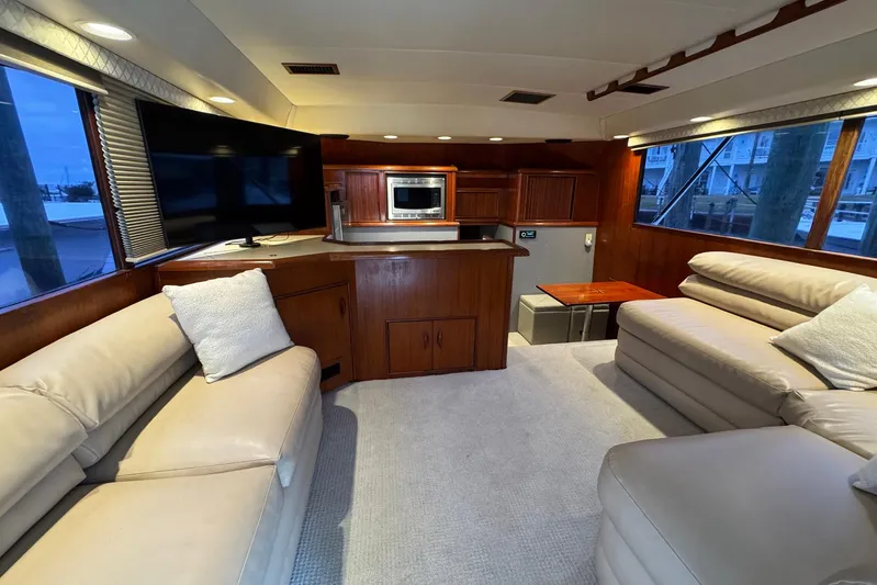 High Tide Yacht Photos Pics Luxurious interior of a 1988 Buddy Davis 47 Convertible yacht with plush seating and modern amenities.