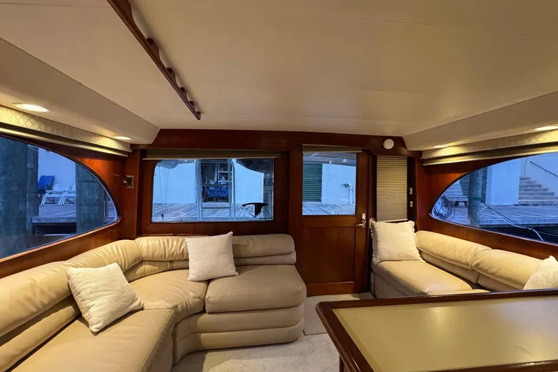 High Tide Yacht Photos Pics Luxurious interior of 1988 Buddy Davis 47 Convertible yacht with plush seating and elegant design.