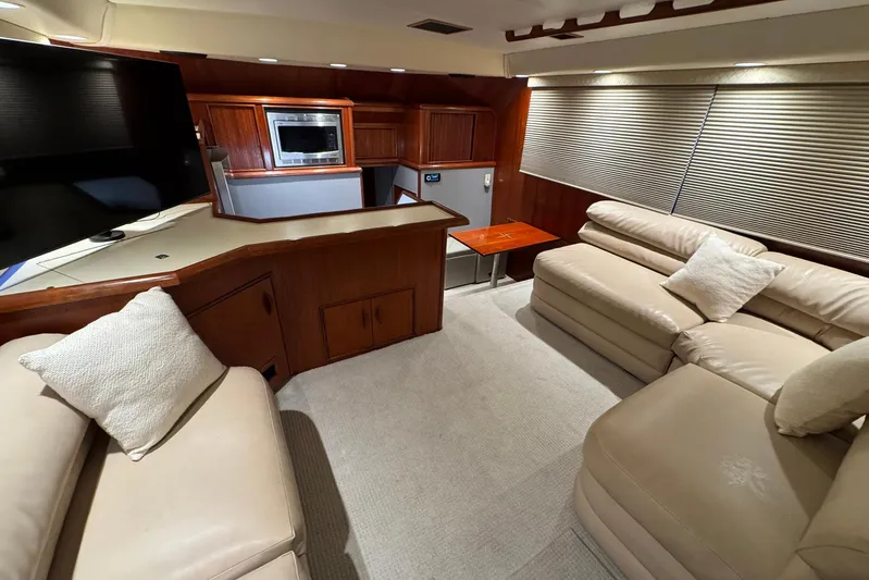 High Tide Yacht Photos Pics Luxurious interior of a 1988 Buddy Davis 47 Convertible yacht with leather seating and modern amenities.