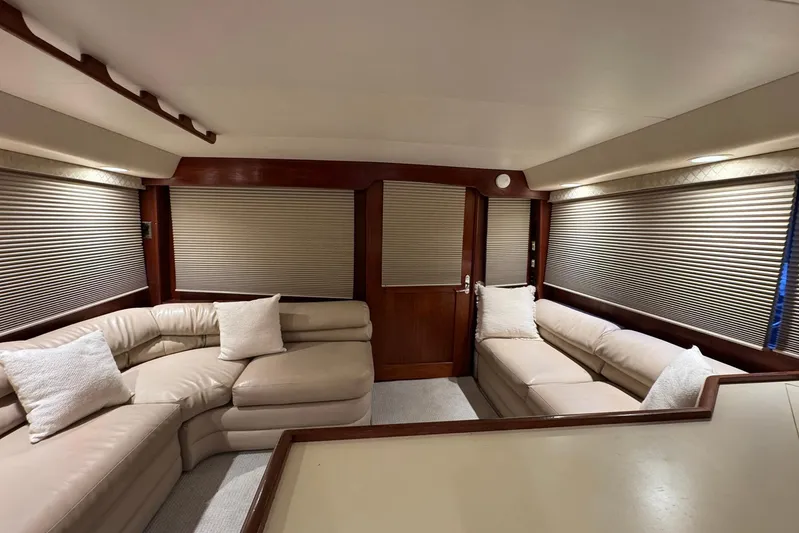 High Tide Yacht Photos Pics Luxurious interior of a 1988 Buddy Davis 47 Convertible yacht with plush seating.