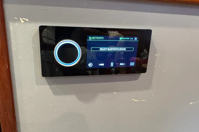 High Tide Yacht Photos Pics Control panel on 1988 Buddy Davis 47 Convertible, displaying Bluetooth device selection.