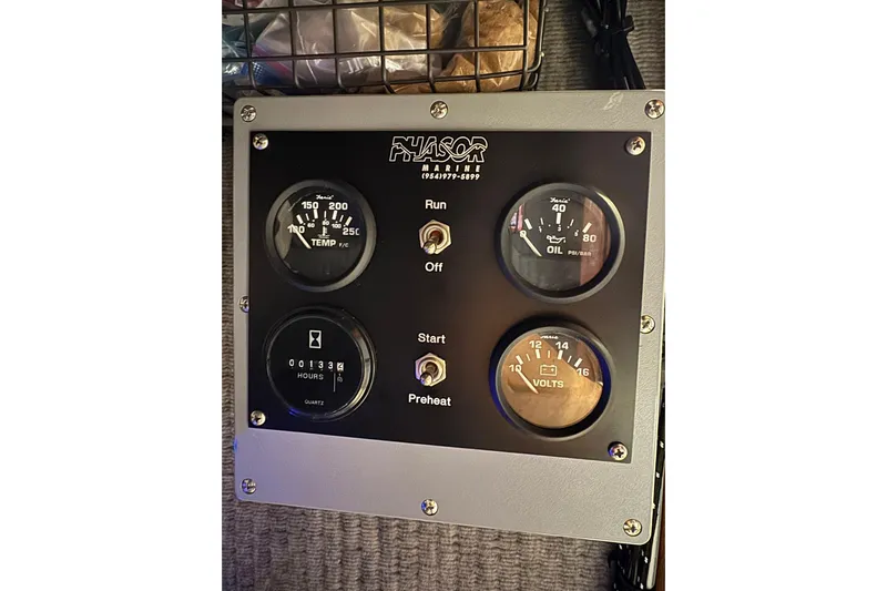 High Tide Yacht Photos Pics Phasor Marine control panel with gauges for temperature, oil, hours, and volts on a 1988 Buddy Davis 47 Convertible.