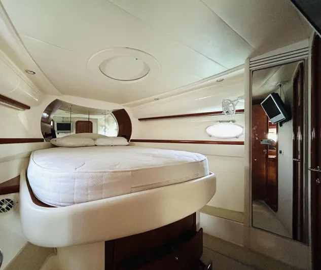  Yacht Photos Pics Luxurious cabin interior of a 2006 Pershing 46 yacht with a comfortable bed.
