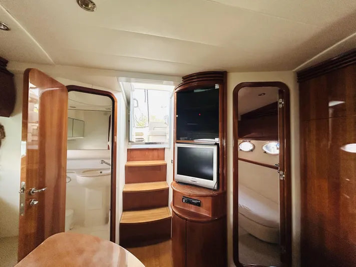  Yacht Photos Pics Luxurious interior of 2006 Pershing 46 yacht with wood finishes and modern amenities.