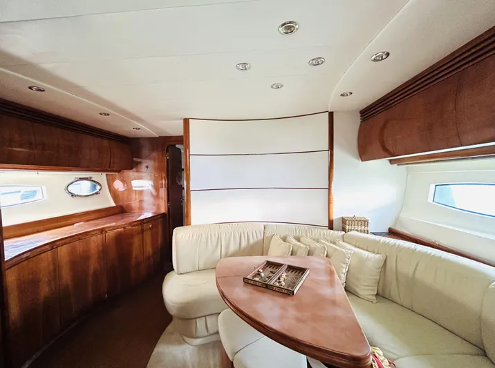 Yacht Photos Pics Luxurious interior of a 2006 Pershing 46 yacht with elegant wood and leather furnishings.