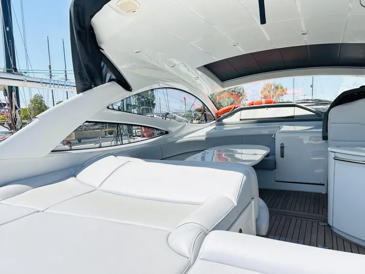  Yacht Photos Pics Luxurious interior of a 2006 Pershing 46 yacht with sleek white seating and modern design.