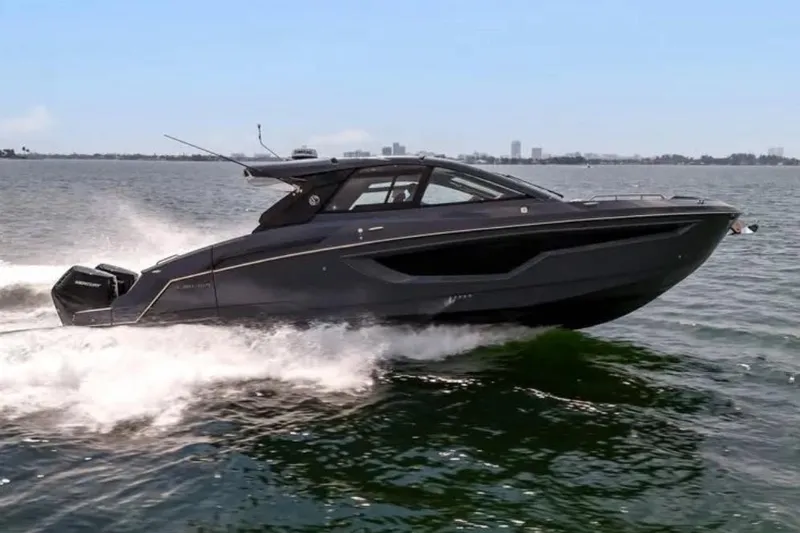  Yacht Photos Pics 2023 Cruisers 42 yacht cruising on open water, sleek design, modern luxury.