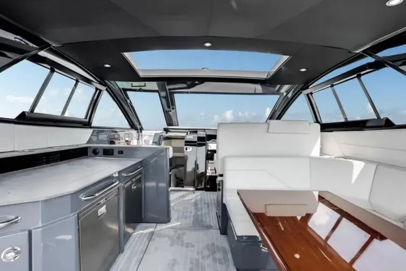  Yacht Photos Pics Luxurious interior of 2023 Cruisers 42 yacht with modern design and panoramic windows.