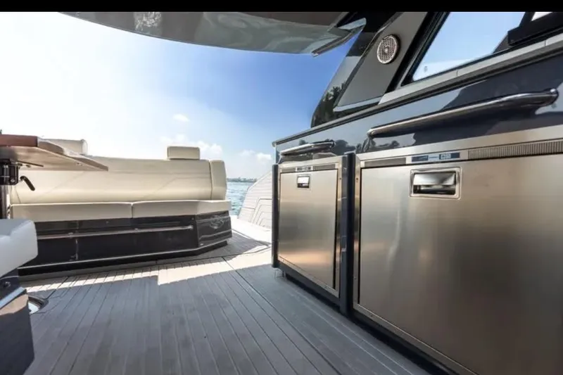  Yacht Photos Pics Luxurious 2023 Cruisers 42 yacht interior with modern seating and stainless steel appliances.