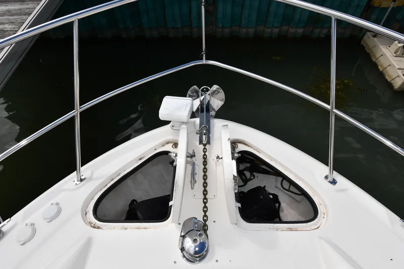 Seriously Yacht Photos Pics Bow view of 2005 Sea Ray 390 Motor Yacht with anchor chain and railing.