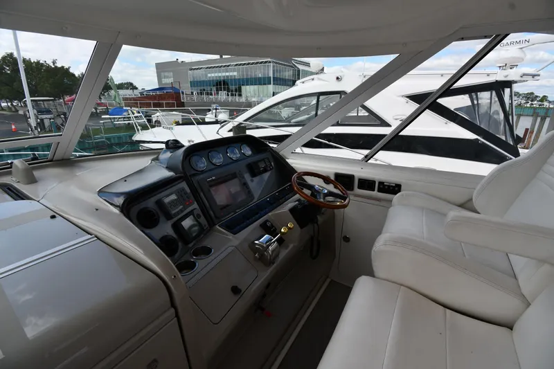 Seriously Yacht Photos Pics 2005 Sea Ray 390 Motor Yacht helm with modern controls and comfortable seating.