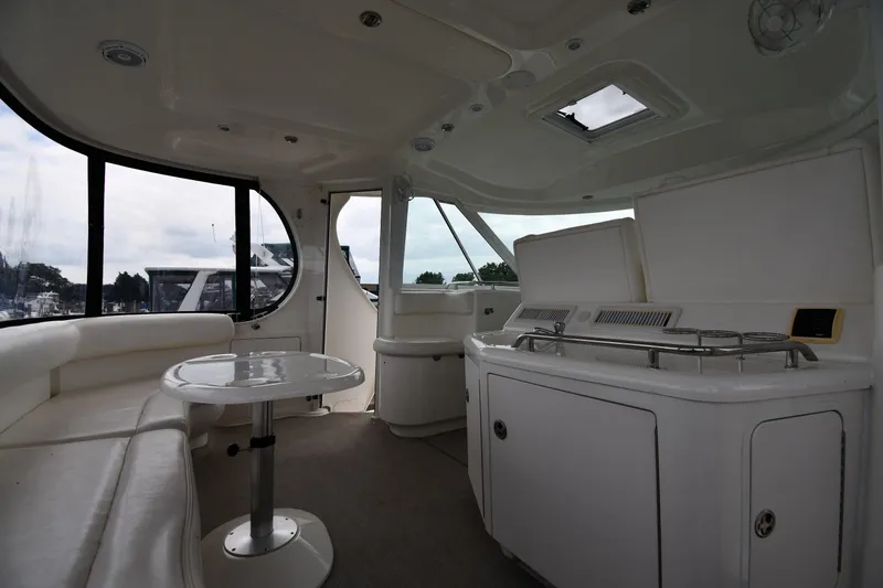 Seriously Yacht Photos Pics 2005 Sea Ray 390 Motor Yacht interior with seating, table, and kitchenette.