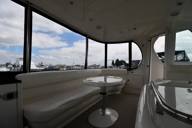 Seriously Yacht Photos Pics Interior of 2005 Sea Ray 390 Motor Yacht with panoramic windows and seating area.